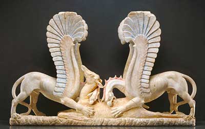 Marble table support in the form of griffins attacking a doe.