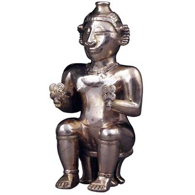 This Quimbaya flask held lime, and the spiral designs held by the female figure were probably representations of fertile, sprouting vegetation. The lime was chewed with coca leaves to produce “clear thinking”… in other words, they got high.