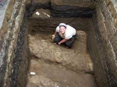 A grad student works in an ancient planting bed for manioc, buried under ten feet of ash 1,400 years ago!